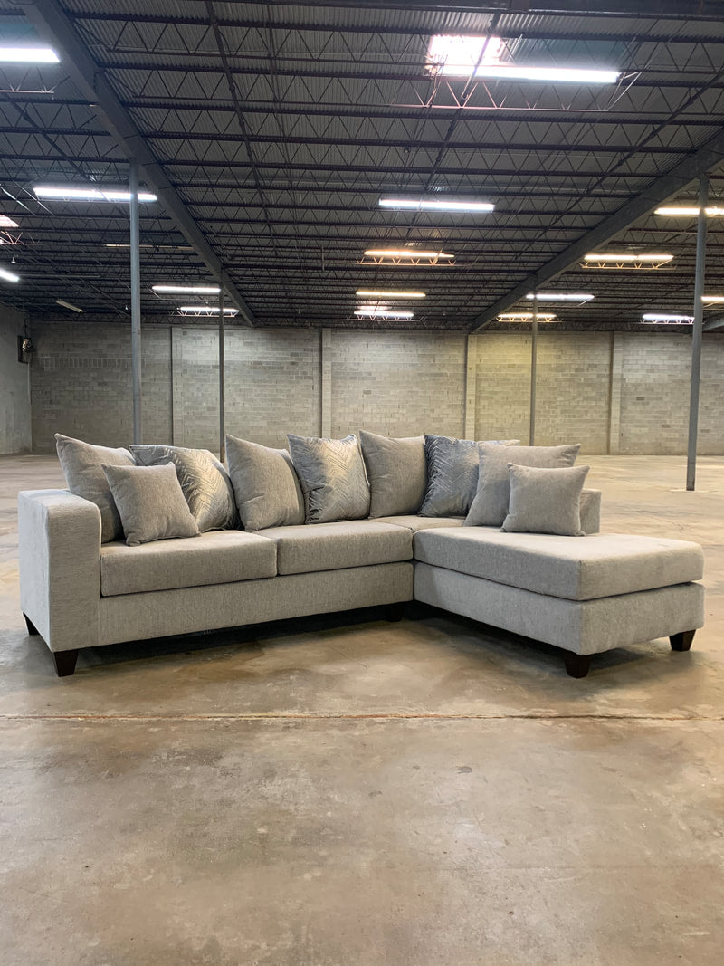 Light Grey Sectional with accent pillows